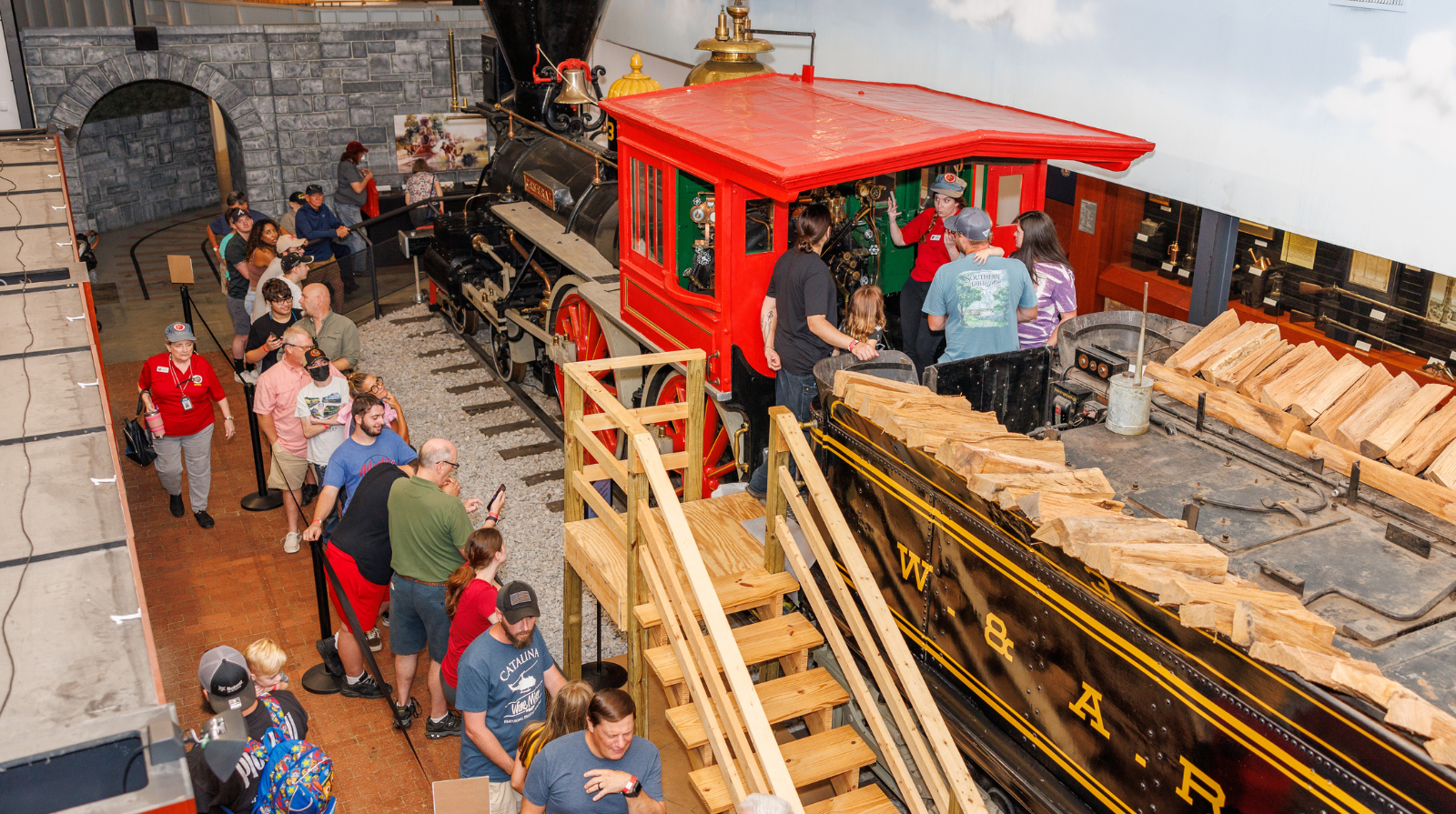 A line of people boarding the famous locomotive train, the General