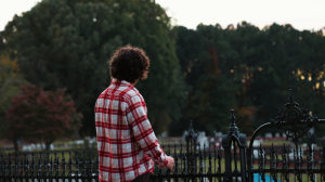 Man looking off into the distance at the Cemetery