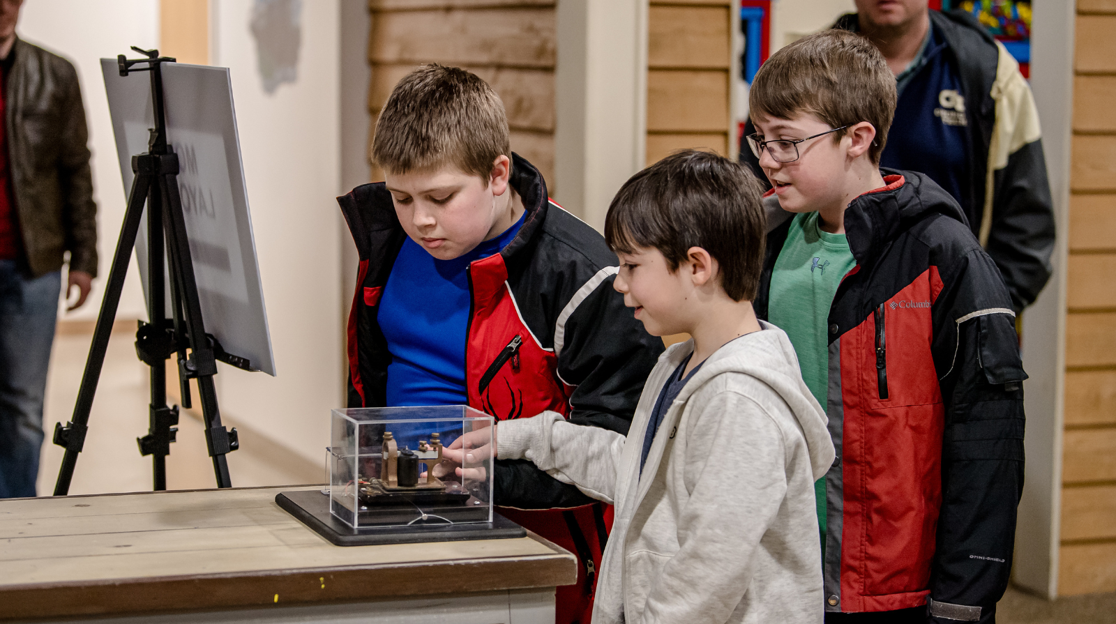 Boys gather around an interactive display at the southern museum.