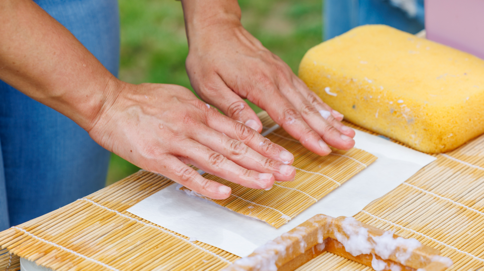 A woman demonstrates papermaking at Smith-Gilbert Gardens.